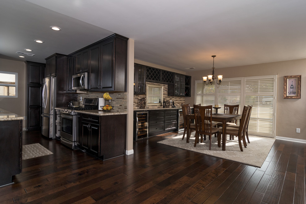 Inspiration for a mid-sized transitional kitchen/dining combo in San Diego with brown floor, beige walls, dark hardwood floors and no fireplace.