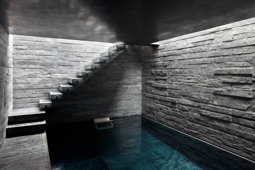 Inspiration for a small contemporary lap pool in London with a pool house.