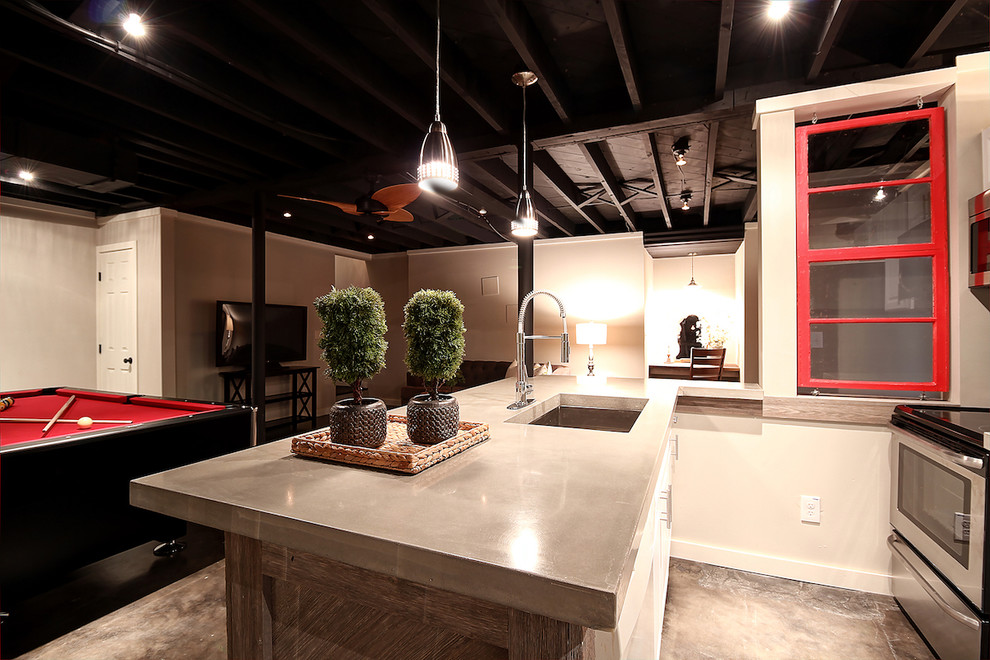 Inspiration for a mid-sized modern walk-out basement in Atlanta with beige walls, concrete floors and brown floor.