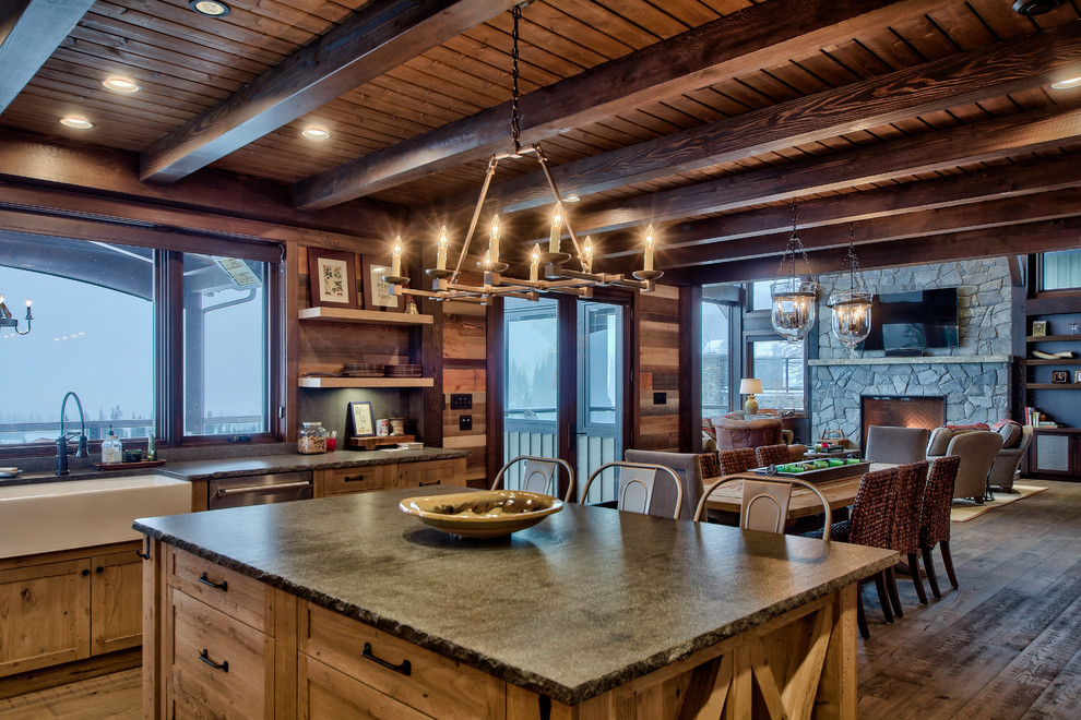 Photo of a large country u-shaped eat-in kitchen in Vancouver with a farmhouse sink, flat-panel cabinets, light wood cabinets, concrete benchtops, stainless steel appliances, light hardwood floors and with island.