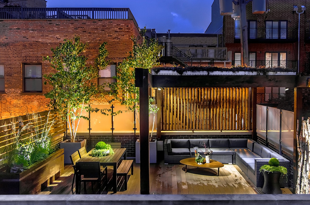 This is an example of a contemporary rooftop and rooftop deck in Chicago with a pergola.