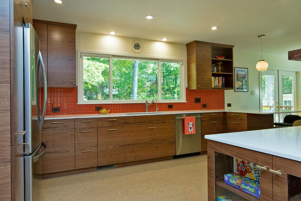 Large midcentury l-shaped eat-in kitchen in Raleigh with a single-bowl sink, flat-panel cabinets, dark wood cabinets, quartz benchtops, orange splashback, cement tile splashback, stainless steel appliances, cork floors, a peninsula, beige floor and white benchtop.