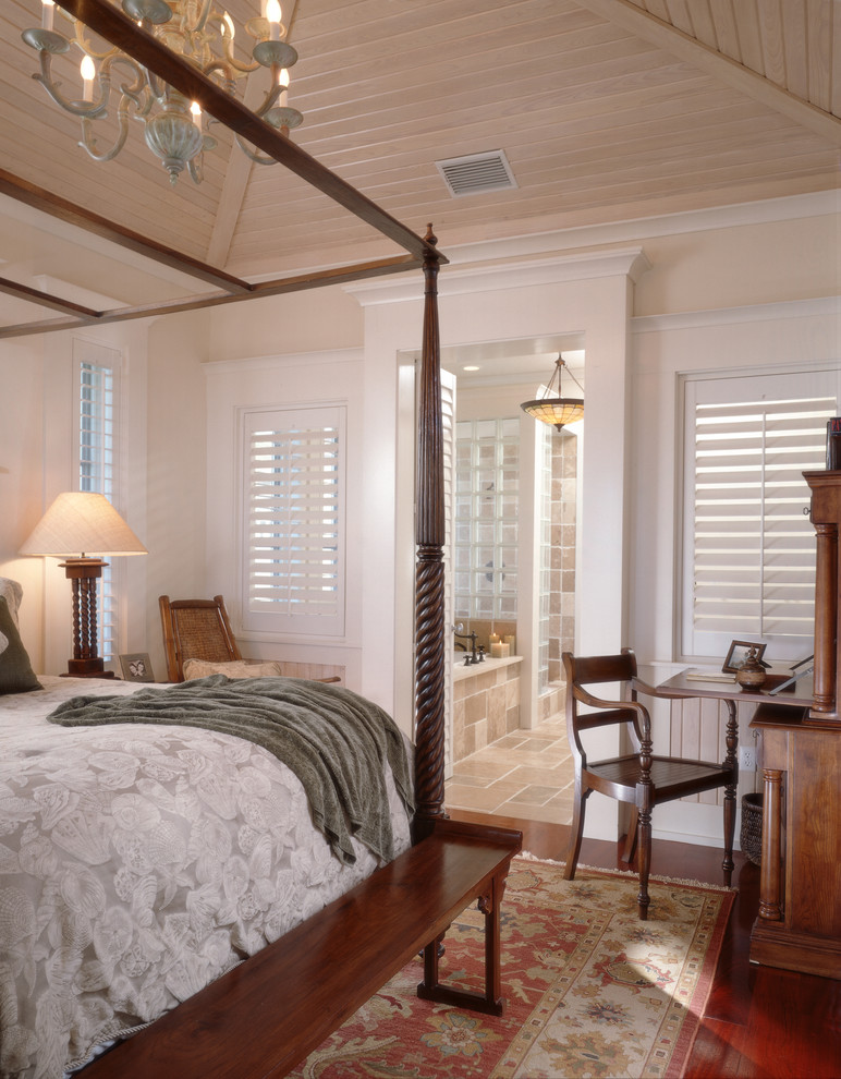 Inspiration for a traditional master bedroom in Tampa with beige walls, medium hardwood floors and no fireplace.