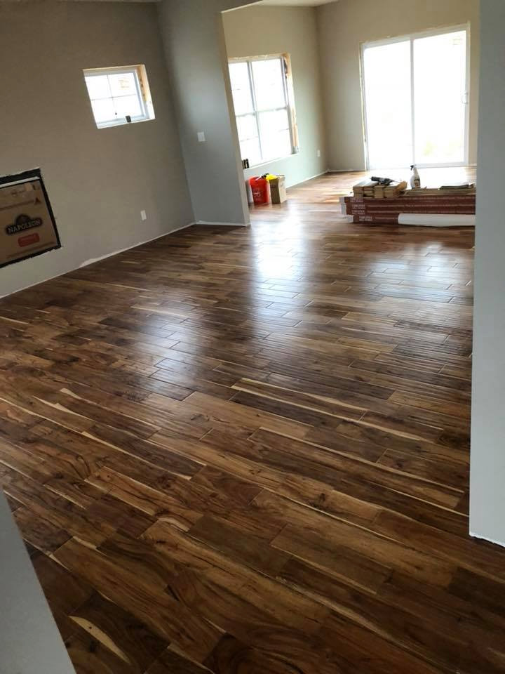 Inspiration for a modern family room in Cedar Rapids with brown floor.