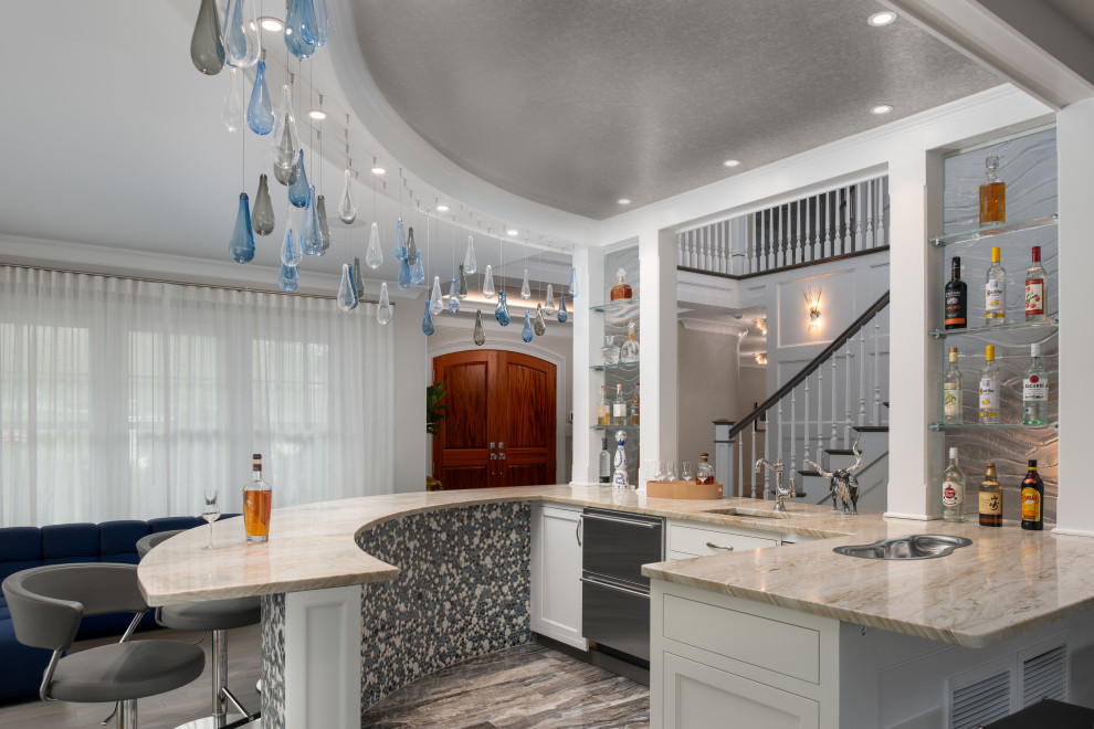 Photo of a transitional u-shaped seated home bar in Providence with an undermount sink, shaker cabinets, white cabinets, grey floor and beige benchtop.