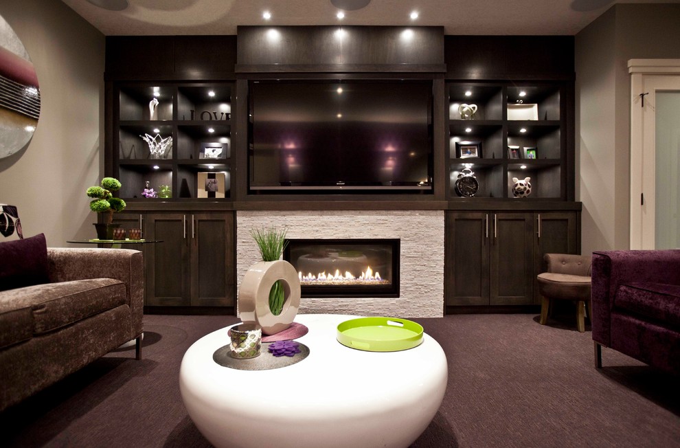 Photo of a transitional living room in Calgary with grey walls, carpet, a ribbon fireplace and a stone fireplace surround.