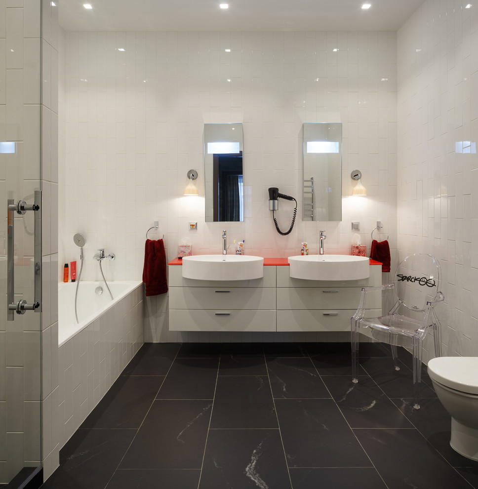 Design ideas for a contemporary master bathroom in Moscow with white cabinets, flat-panel cabinets, an alcove tub, white tile, black tile, white walls and a drop-in sink.