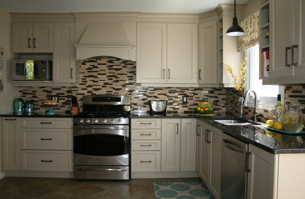 Small transitional l-shaped enclosed kitchen photo in Ottawa with an undermount sink, shaker cabinets, beige cabinets, granite countertops, glass sheet backsplash, stainless steel appliances and no island