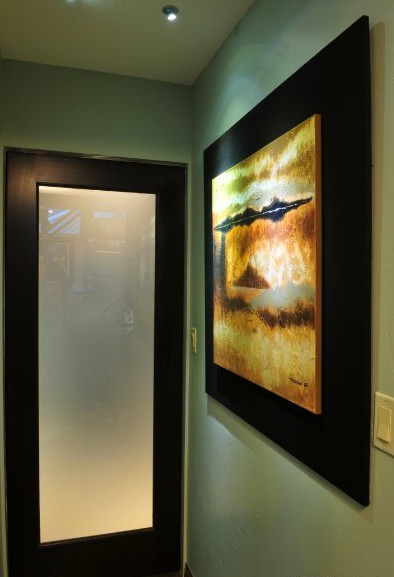 Example of a transitional home design design in Denver