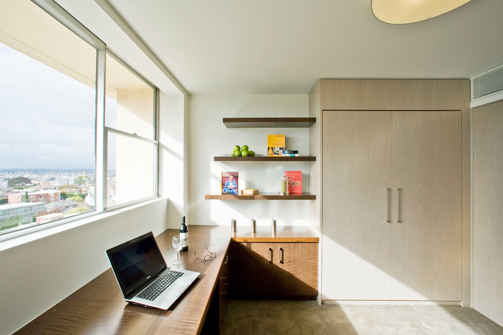 Small modern study room in Melbourne with white walls and a built-in desk.