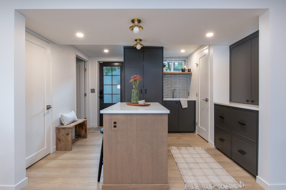 Basement - mid-sized transitional basement idea in Seattle