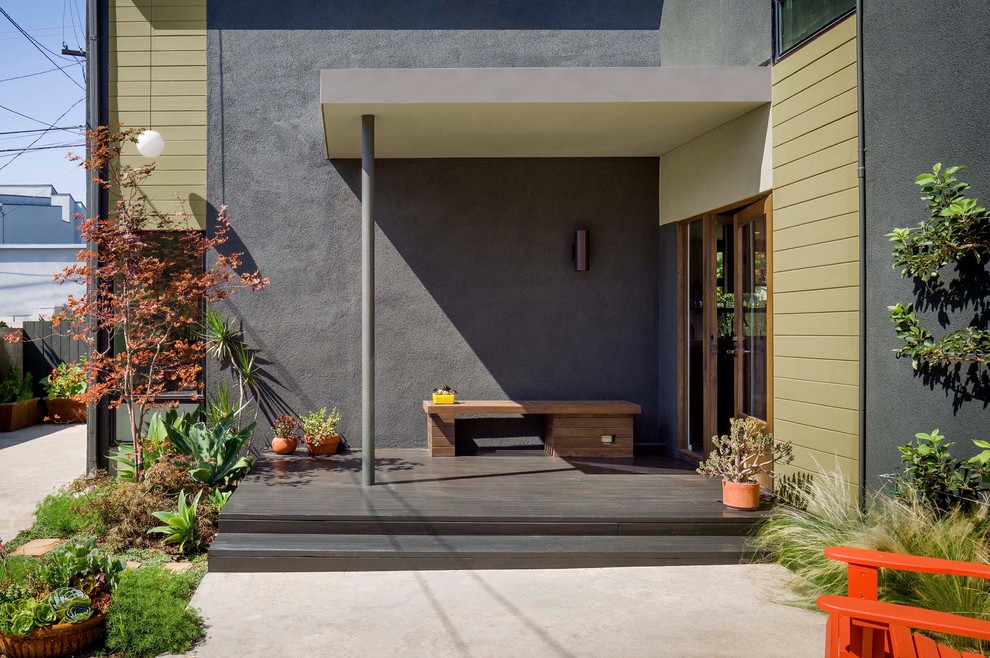Design ideas for a small contemporary two-storey stucco black exterior in Los Angeles.