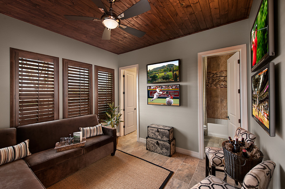 Contemporary enclosed family room in Phoenix with grey walls and a wall-mounted tv.