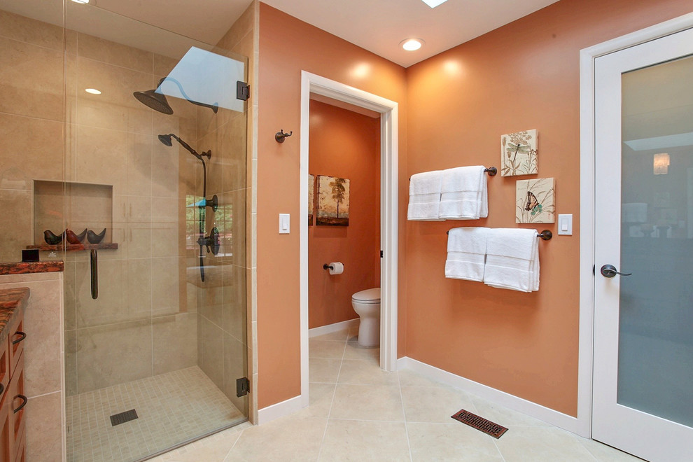 Design ideas for a mid-sized transitional master bathroom in San Francisco with an alcove shower, beige tile, porcelain tile, porcelain floors, granite benchtops, beige floor and a hinged shower door.
