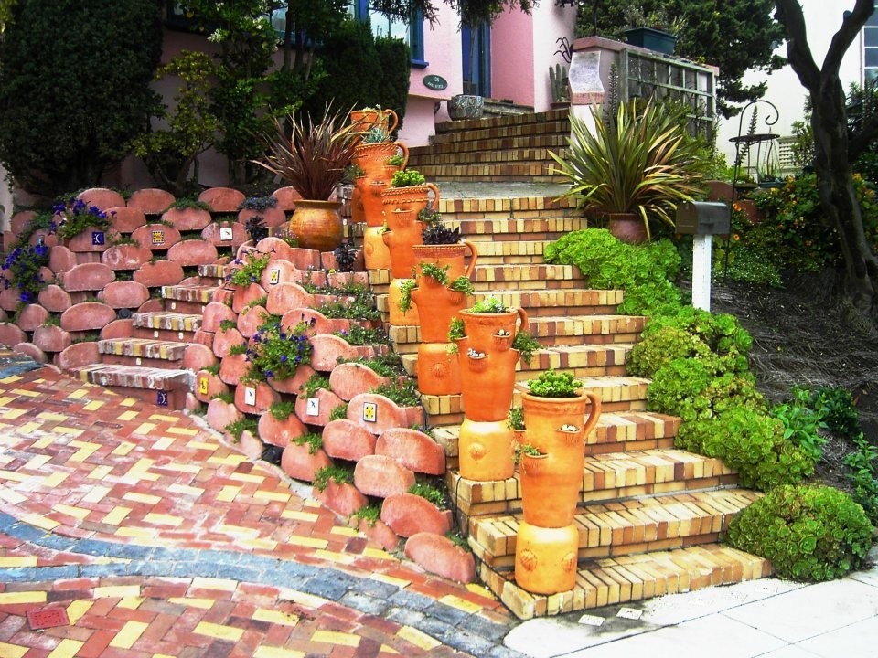 Front Yard with Artistic Driveway, Custom Sculptures, Planted Walls