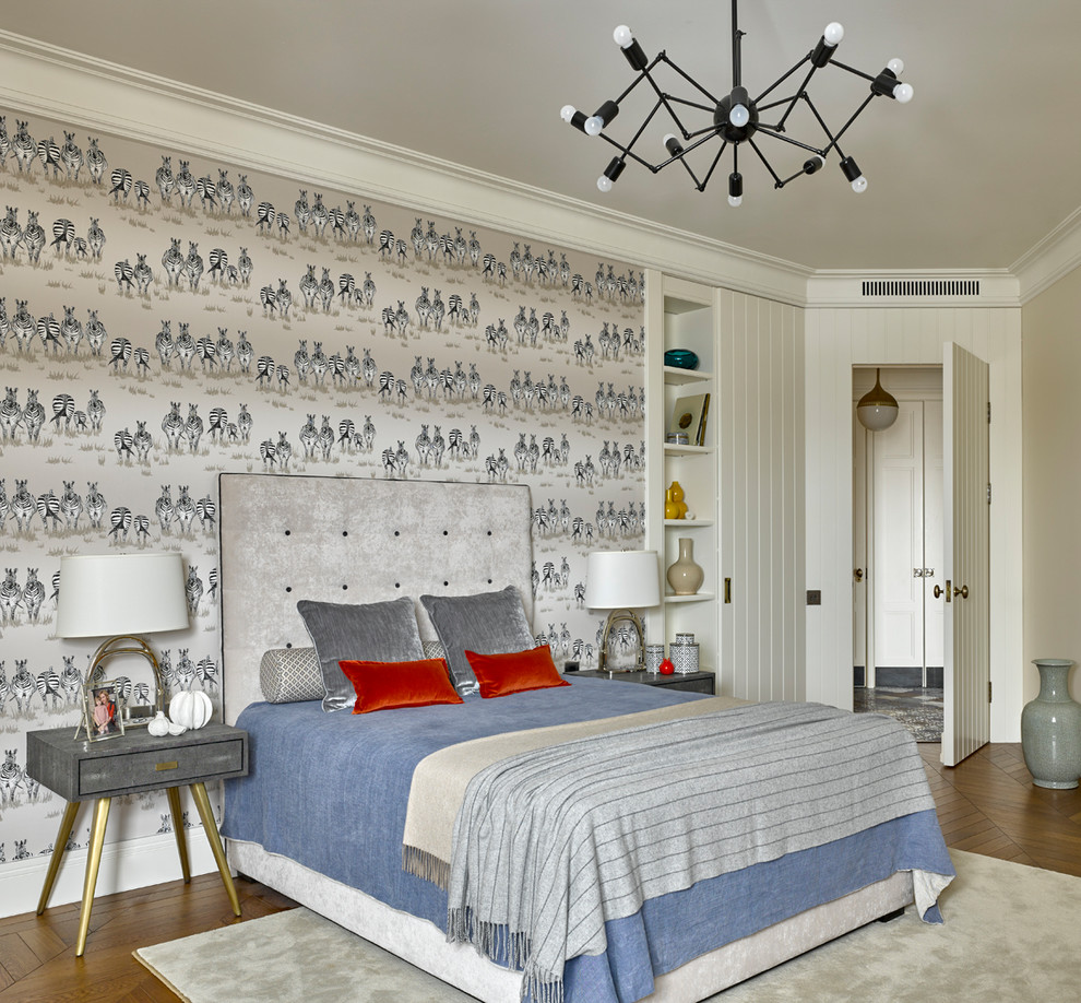 This is an example of a transitional bedroom in Moscow with grey walls, medium hardwood floors and brown floor.
