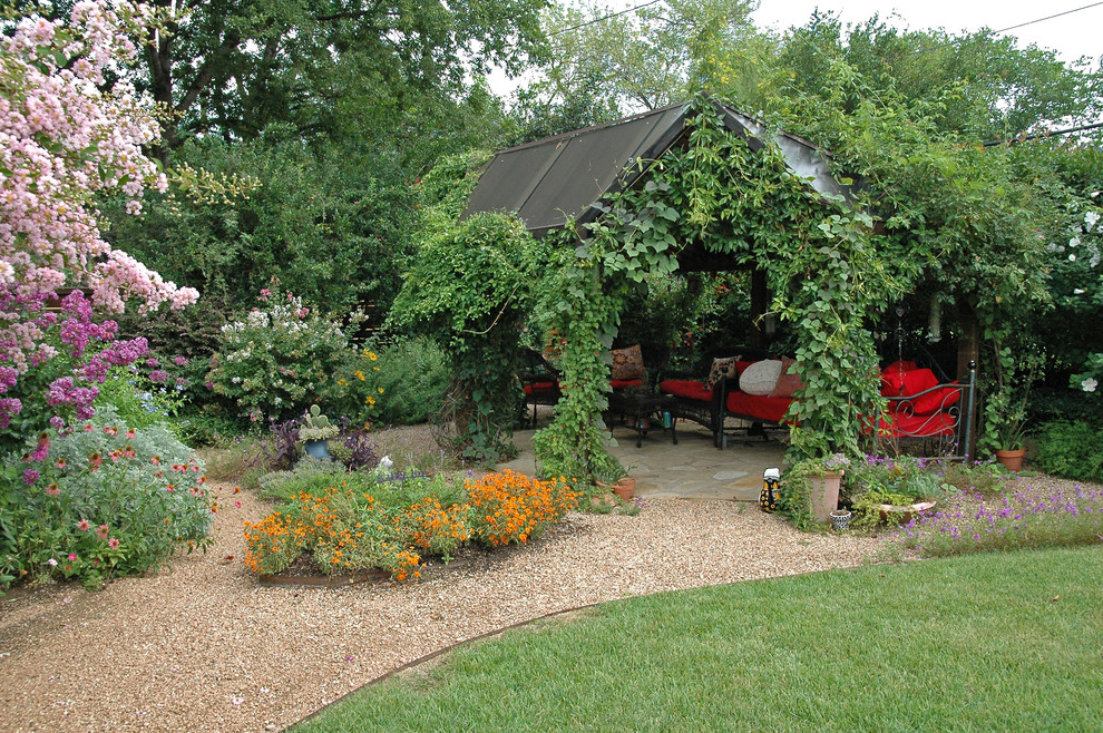 Design ideas for a large contemporary backyard patio in Austin with a vertical garden, gravel and a gazebo/cabana.