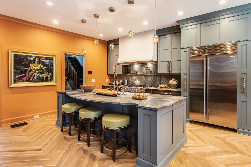 Design ideas for a large eclectic single-wall separate kitchen in Indianapolis with a farmhouse sink, recessed-panel cabinets, blue cabinets, quartzite benchtops, blue splashback, stone tile splashback, coloured appliances, light hardwood floors, with island, beige floor and blue benchtop.