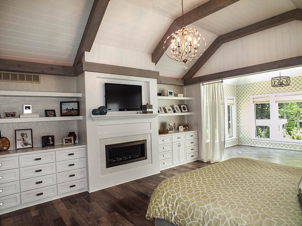 Photo of a large contemporary master bedroom in Cleveland with white walls, dark hardwood floors, a standard fireplace and a stone fireplace surround.