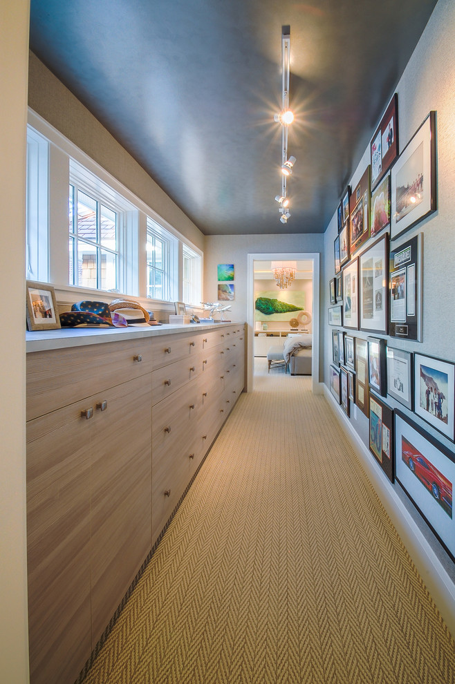Design ideas for a mid-sized beach style hallway in Minneapolis with grey walls and carpet.