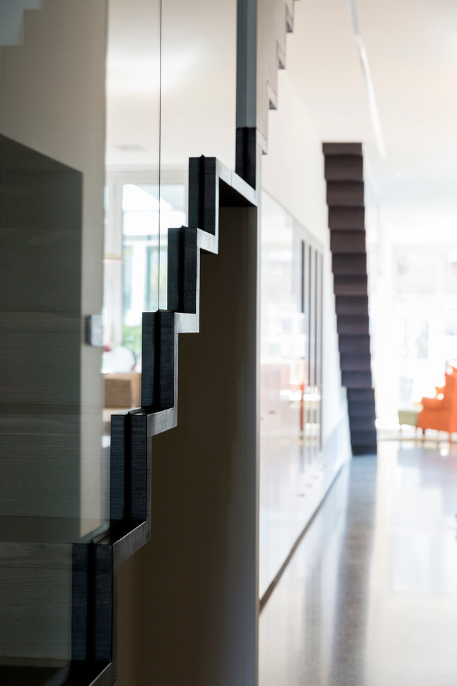 Mid-sized contemporary wood straight staircase in Melbourne with wood risers.