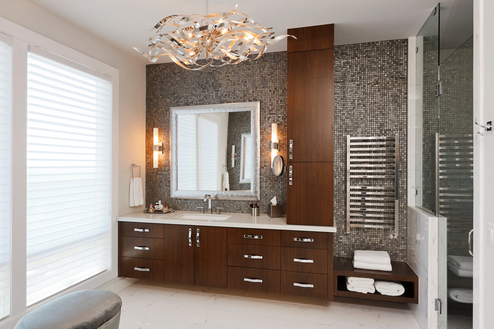 Photo of a mid-sized contemporary master bathroom in Portland with an undermount sink, flat-panel cabinets, dark wood cabinets, an alcove shower, gray tile, mosaic tile, a two-piece toilet, white walls, marble floors, solid surface benchtops, white floor and a hinged shower door.