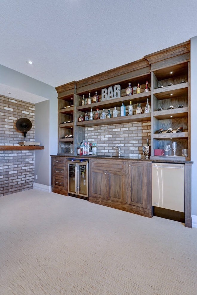 Arts and crafts single-wall wet bar in Calgary with an undermount sink, shaker cabinets, medium wood cabinets, granite benchtops, brick splashback and black benchtop.