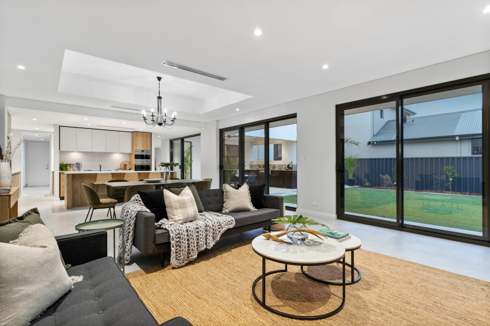 Design ideas for a contemporary open concept living room in Perth with grey walls and grey floor.