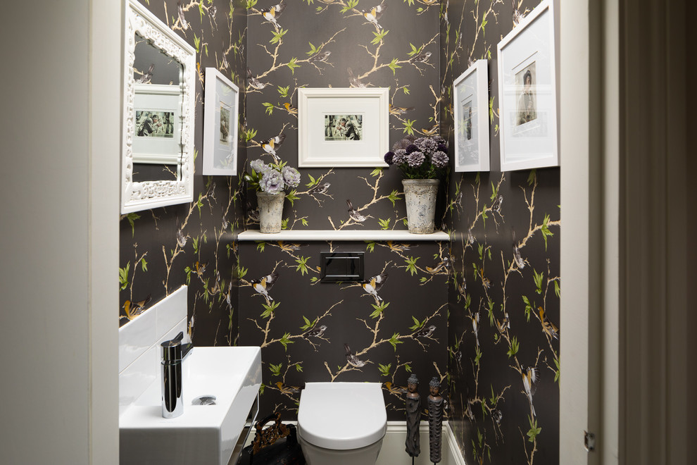 This is an example of a transitional powder room in London.