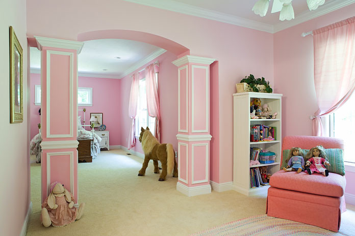 Large traditional kids' bedroom in Charleston with pink walls and carpet for girls.
