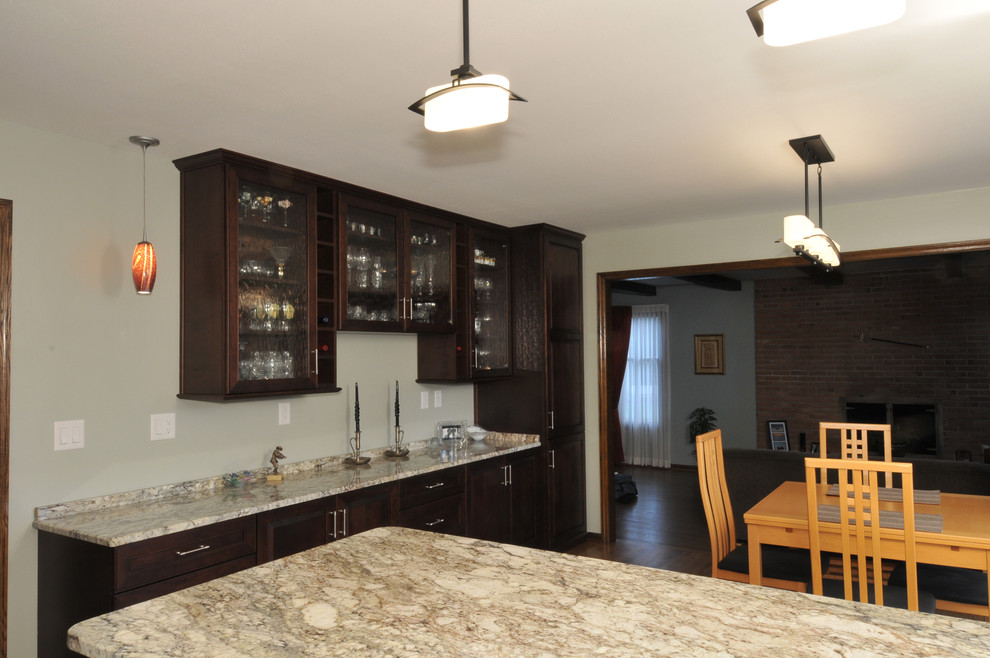 Design ideas for a mid-sized transitional kitchen/dining combo in Milwaukee with medium hardwood floors.