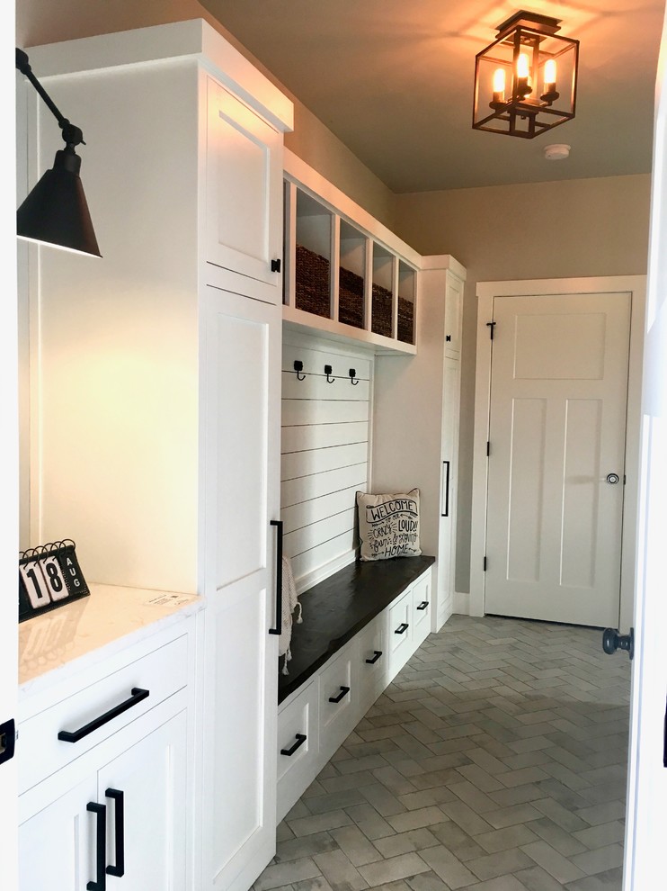 Inspiration for a mid-sized country mudroom in Other with grey walls, ceramic floors, a single front door, a white front door and grey floor.