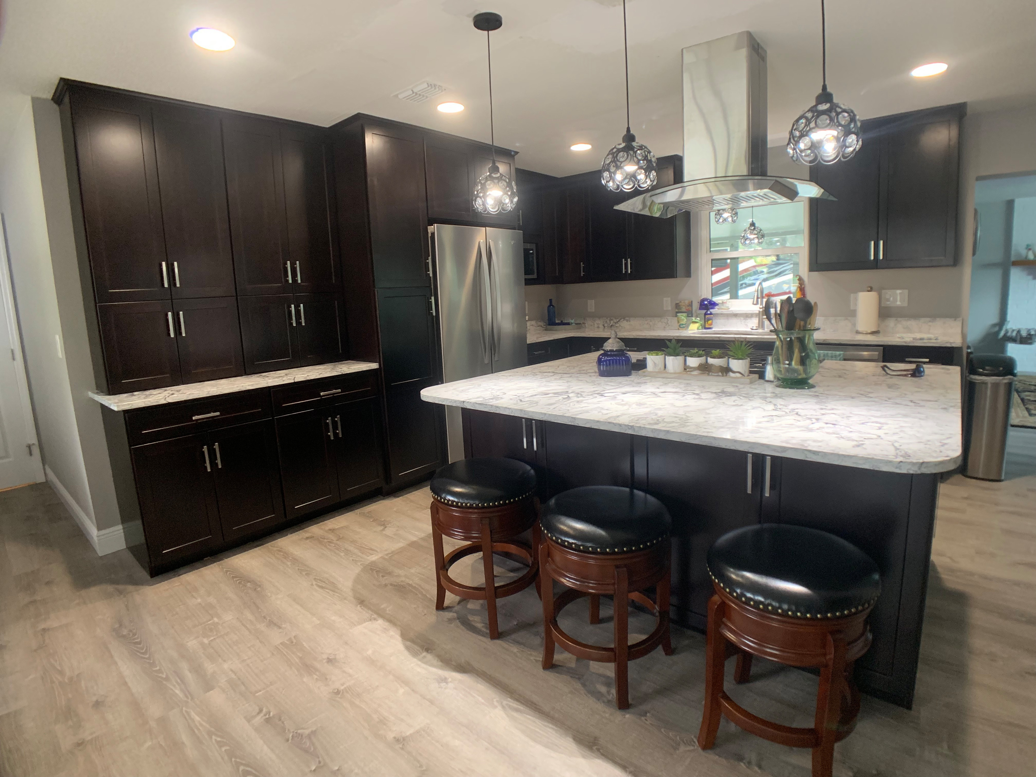 This was a pretty major kitchen remodel under taken by the home owner.  He removed several walls and incorporated a former family room into an expanded kitchen with an island.  The impact of this chan