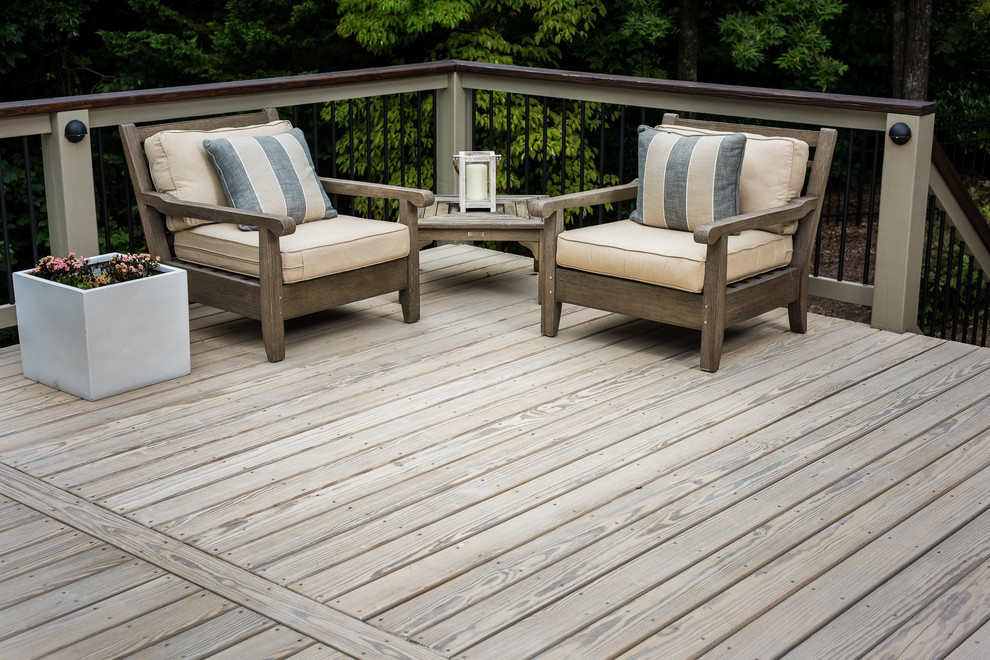 Inspiration for a large transitional backyard outdoor kitchen deck remodel in Atlanta with a roof extension