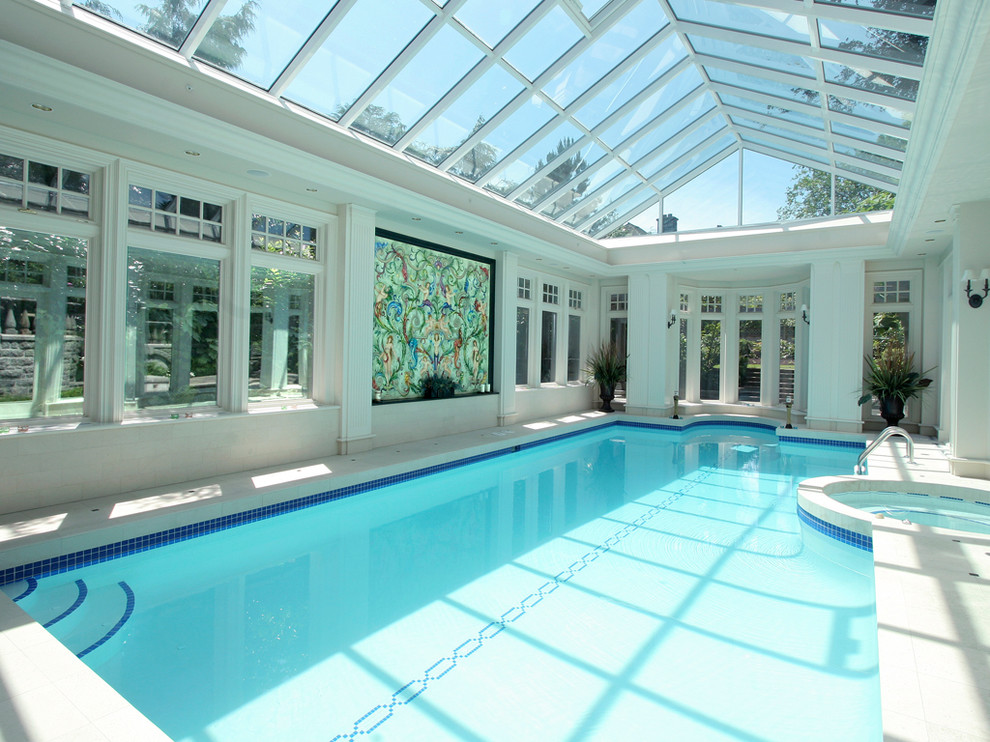 Design ideas for a contemporary custom-shaped pool in Vancouver with a hot tub.