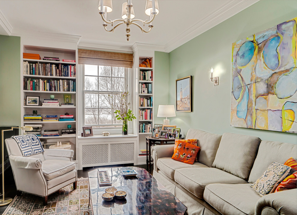 Small traditional enclosed living room in New York with a library and a built-in media wall.