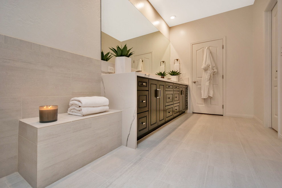 Inspiration for a large contemporary master bathroom in Phoenix with raised-panel cabinets, black cabinets, a freestanding tub, an open shower, gray tile, porcelain tile, grey walls, porcelain floors, an undermount sink, engineered quartz benchtops, grey floor, an open shower and white benchtops.