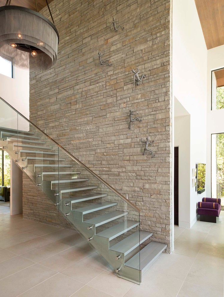 This is an example of a contemporary straight staircase in Dallas with open risers.