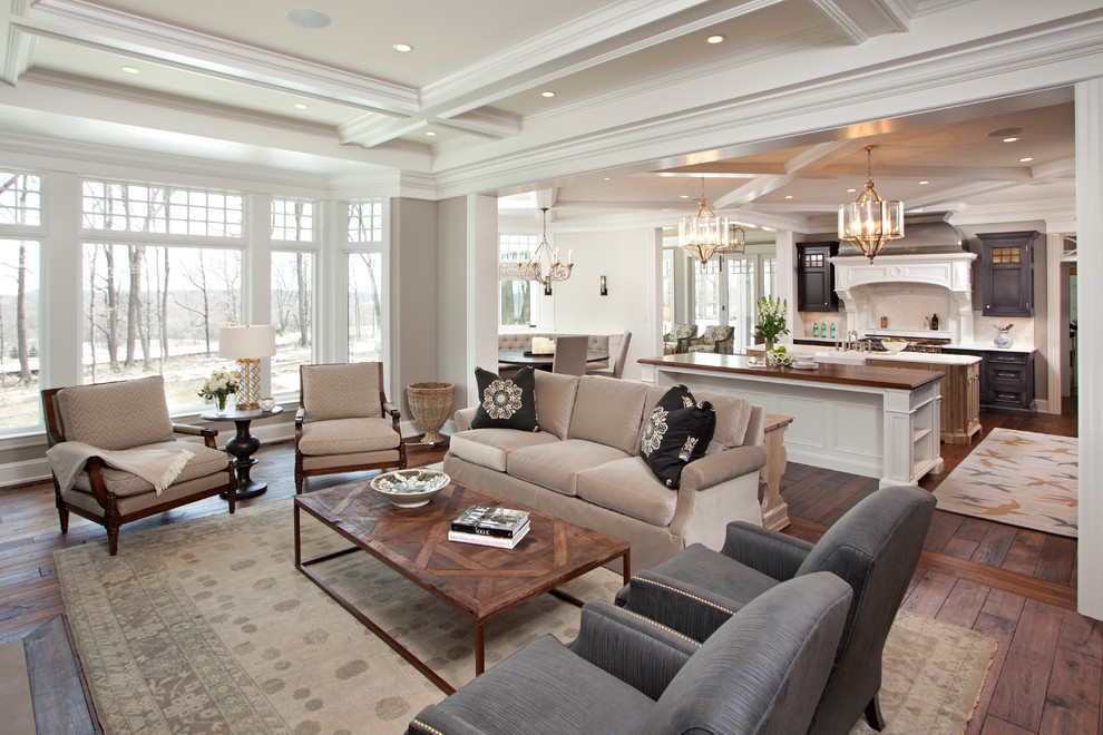 This is an example of a traditional open concept living room in Minneapolis with grey walls, brown floor and coffered.