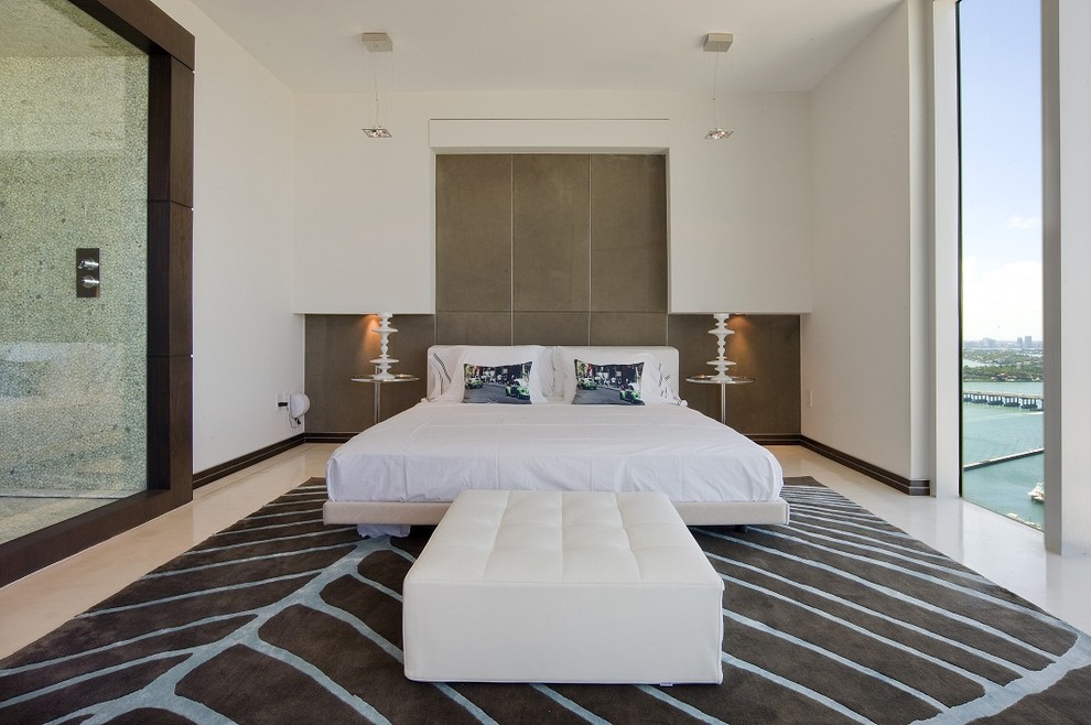 This is an example of a modern bedroom in Miami with beige walls.