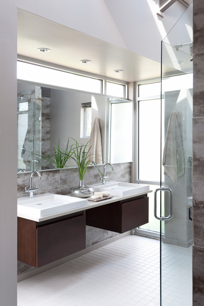 Inspiration for a mid-sized industrial master bathroom in Chicago with flat-panel cabinets, dark wood cabinets, brown tile, gray tile, a vessel sink, white floor, a hinged shower door, white benchtops and engineered quartz benchtops.