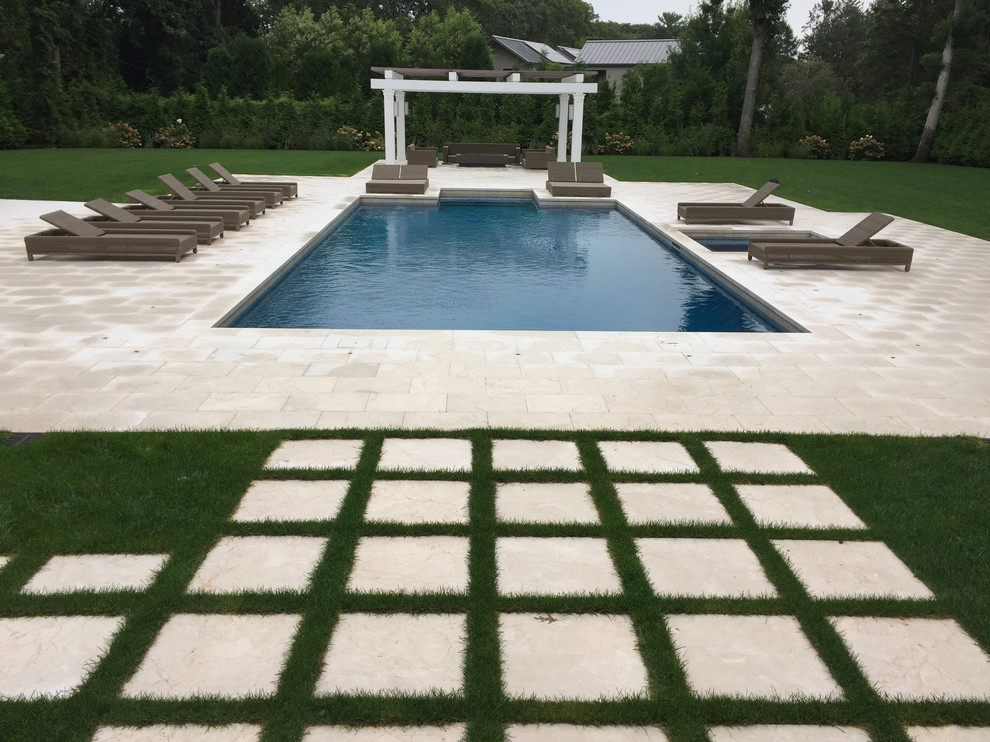 Pool house - large backyard stone and rectangular aboveground pool house idea in New York