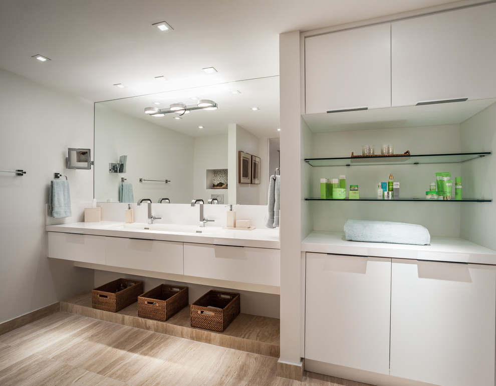 This is an example of a mid-sized contemporary master bathroom in Miami with flat-panel cabinets, white cabinets and grey walls.