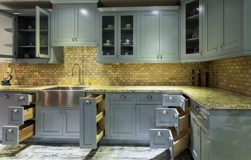 Kitchen with multiple cabinet doors and drawers open, showing RTA hinges and slides—ideal view for explaining three-way European hinge adjustments for side-to-side, depth, and height alignment