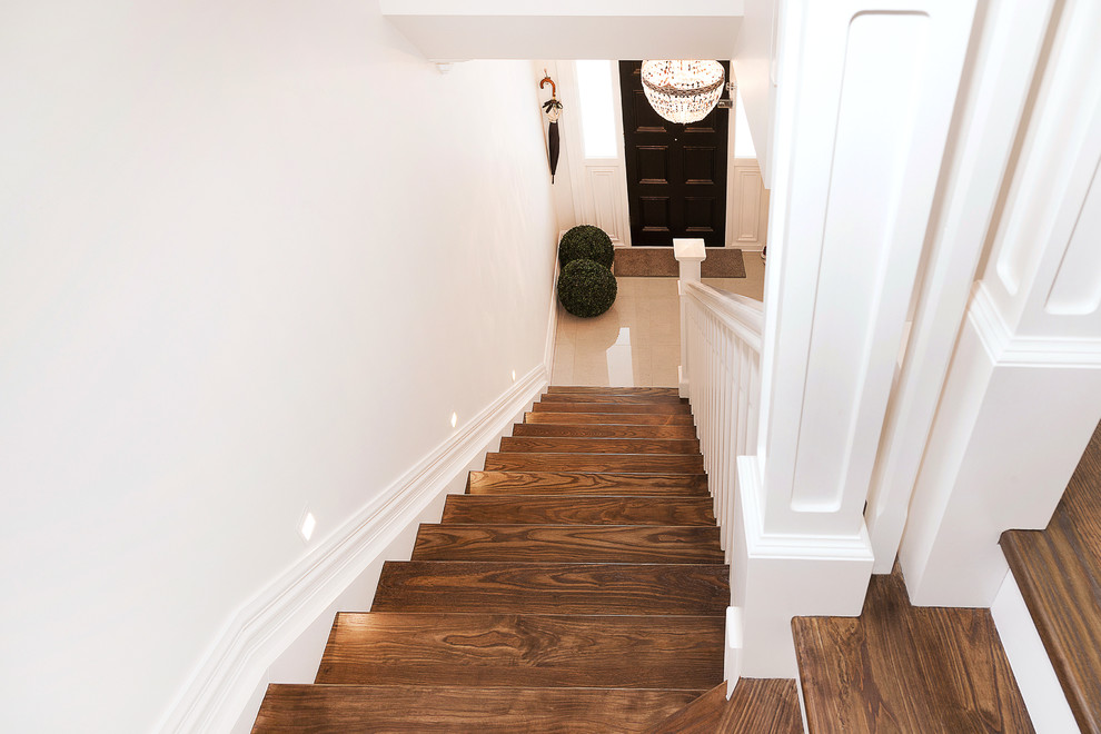 Mid-sized traditional wood l-shaped staircase in Wellington with wood risers.