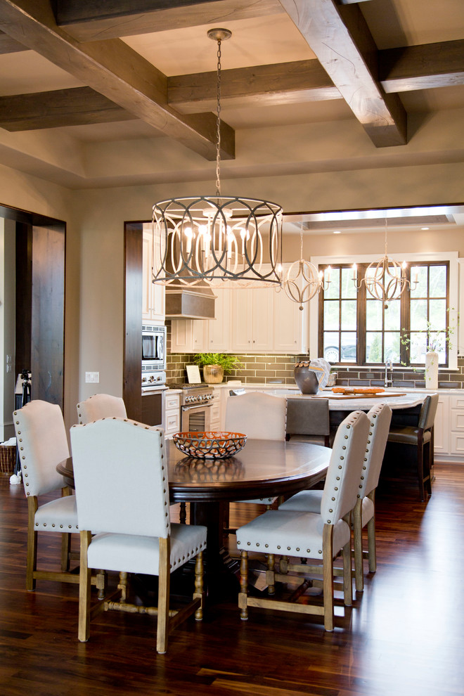 Photo of a large transitional kitchen/dining combo in Other with beige walls and dark hardwood floors.
