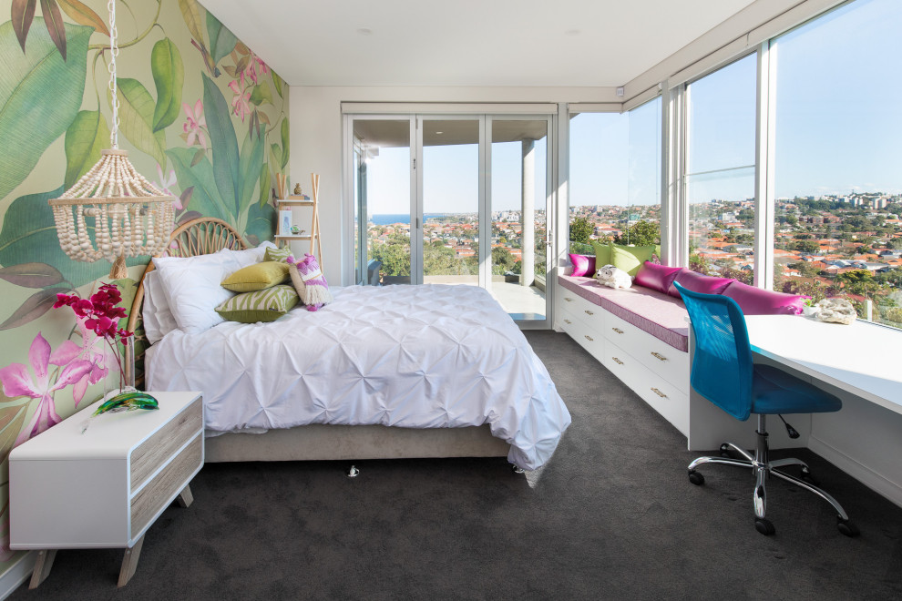 This is an example of a contemporary kids' room for girls in Sydney with carpet, grey floor and multi-coloured walls.