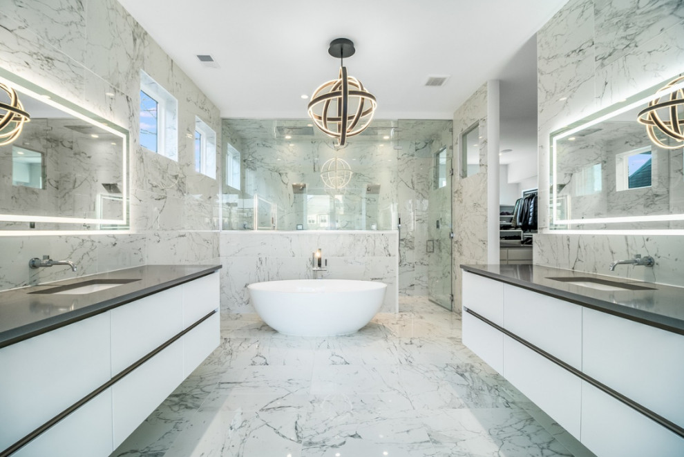 Photo of a large contemporary master bathroom in Chicago with flat-panel cabinets, white cabinets, a japanese tub, a double shower, a one-piece toilet, gray tile, a hinged shower door, a shower seat, a double vanity, a floating vanity, marble, grey walls, marble floors, an undermount sink, marble benchtops, grey floor and grey benchtops.