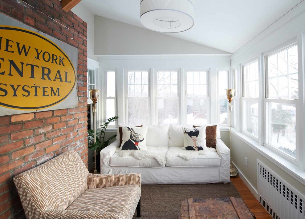 This is an example of a small transitional sunroom in New York.