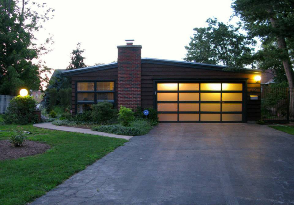 Design ideas for a mid-sized midcentury attached two-car garage in New York.